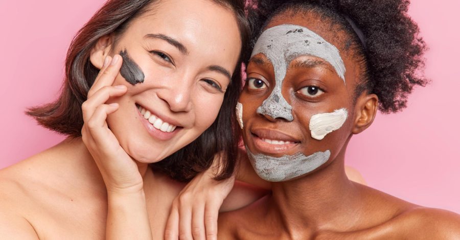 two-diverse-women-apply-clay-mask-face-smile-gladfully-stand-shirtless-indoor-have-friendly-relationship-have-good-skin-condition-isolated-pink-background-facial-treatment-wellness